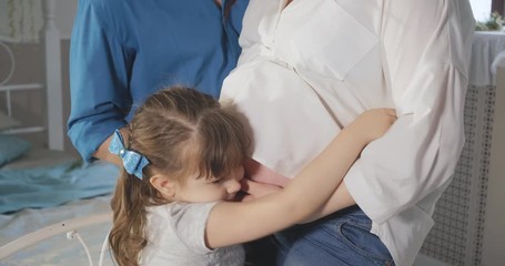 Young pregnant couple in love expecting a new child.