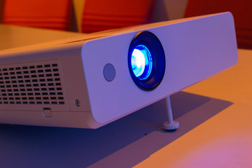 projector for presentation in a meeting room (Light in a light yellow tone room.)