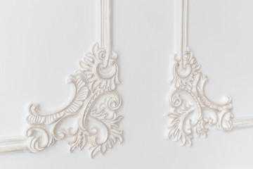 Decoration molding frame item made of white plaster. Relief stucco interior