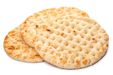 whole greek pita bread isolated on white background