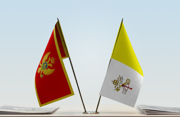 Two flags of Montenegro and Vatican City