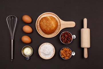 Ingredients for making bread on black background. Cooking breakfast concept. Flat lay, Top view