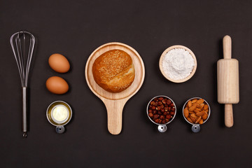 Ingredients for making bread on black background. Cooking breakfast concept. Flat lay, Top view