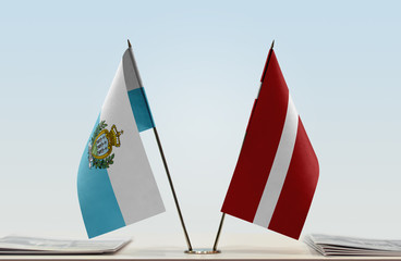 Two flags of San Marino and Latvia