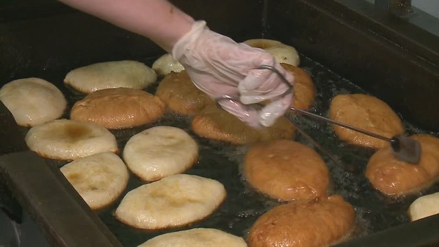 pies are fried in boiling oil