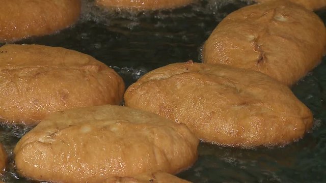 pies are fried in boiling oil