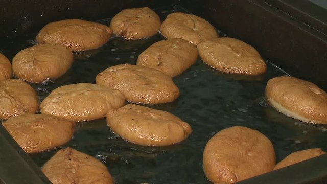 pies are fried in boiling oil