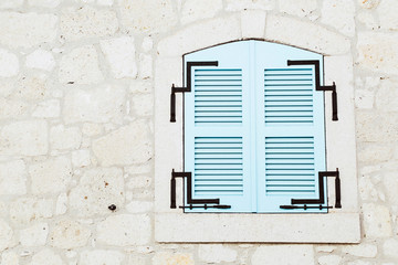 vintage blue window on white wall