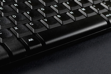 Black keyboard close-up. PC peripherals