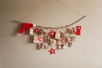 the advent calendar hanging on the wall. small gifts surprises for children