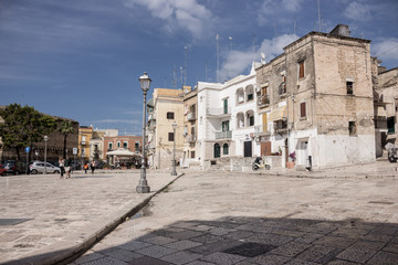 Mediterranean square with ancient white buildings with television antennas. Italian traditional...