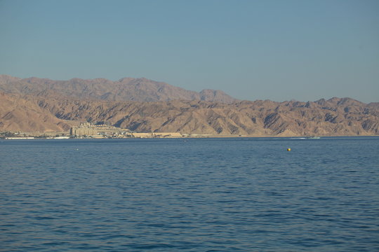 view of the mountains and Jordan through the sea from the city of Eilat Israel