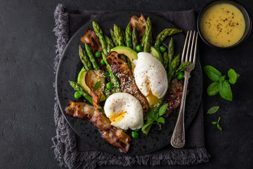 asparagus, avocado, poached egg and fried bacon  salad