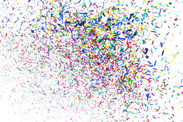Festival. Multicolored explosion of particles of lead colored pencils on white background.