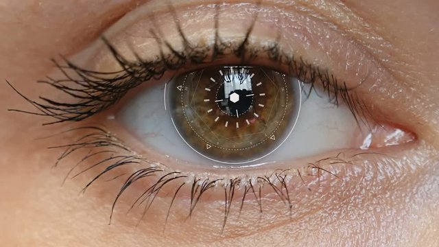 Brown eye girl with futuristic software interface.