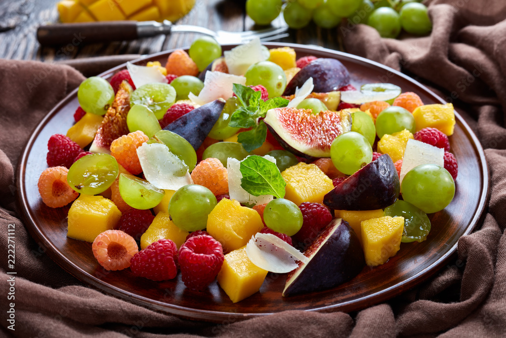 Wall mural fruit salad with figs, raspberries, grapes