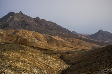 amazing mountains valley panorama in fuerteventura canary island. africa beauty and vulcans land with no huan and nobody. natural landscape timeless perfect to trek and  hike. discover the world