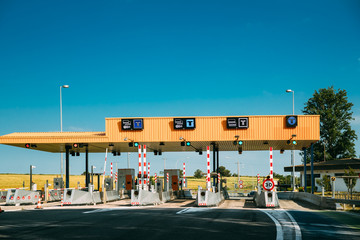 Cars Passing Through The Automatic Point Of Payment On A Toll Ro