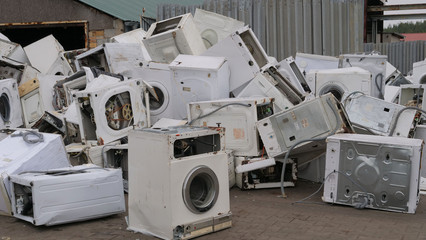 Scrap metal of old, used washing machines.