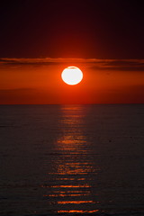 baltic seaside with red sun goes down