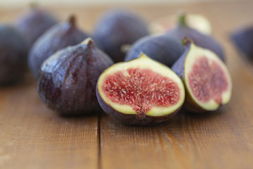 Ripe figs on a wooden table, close-up. Fresh fruit - figs.