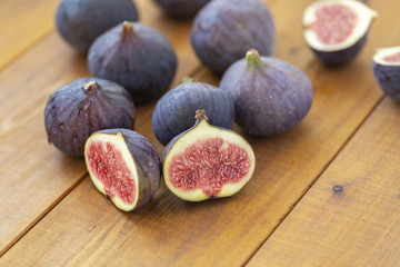 Ripe figs on a wooden table, close-up. Fresh fruit - figs.