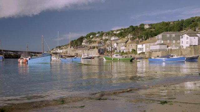 Static low wide angle clip of harbour of Mousehole in Cornwall 