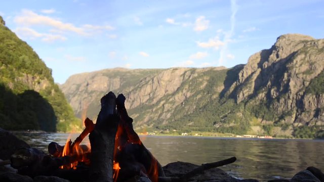 Campfire on the shore of a Fjord in Norway