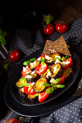 Eggplant grilled with aromatic feta cheese and tomatoes