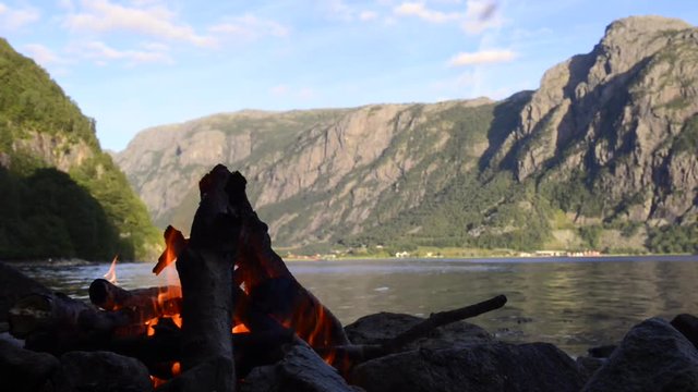Campfire on the shore of a Fjord in Norway