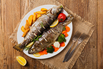 Grilled whole trout. Served with baked potatoes.