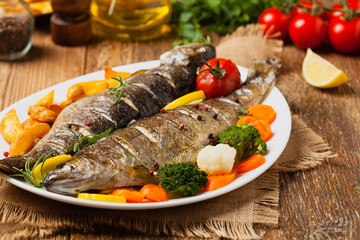 Grilled whole trout. Served with baked potatoes.