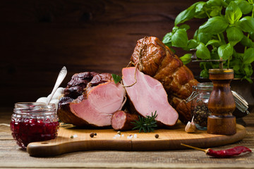 Smoked pork on wooden board.
