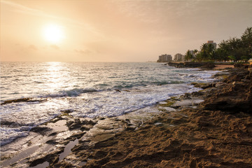 Beautiful sunrise at the rugged coast of the pacific in San Juan, Puerto Rico