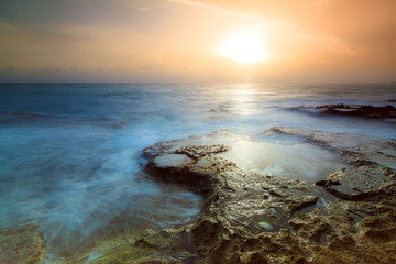 Beautiful sunrise at the rugged coast of the pacific in San Juan, Puerto Rico