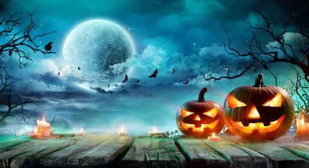 Foto op Plexiglas Halloween - Jack O' Lanterns And Candles On Table In Misty Night   © Romolo Tavani