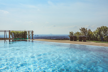 Outdoor swimming pool with beautiful view over city