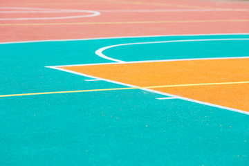 Fragment of an open basketball court with artificial surface.