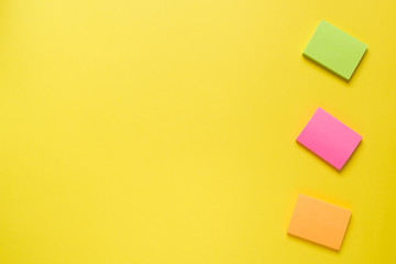 Office supplies on yellow table with copy space. Education concept, school and office.