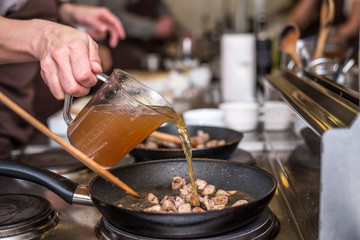Woman in the kitchen cooking