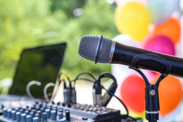 Microphone over the Abstract blurred photo of conference hall or seminar room background