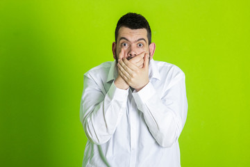 Frightened man stood with a frightened look on his face