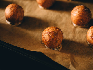 Hot prepared meat balls on baking sheet with paper