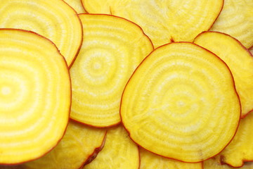 Beets are yellow slices. Horizontal frame.