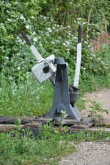 Fototapeta na wymiar Old broken railway arrow