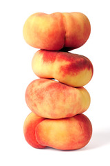 pile of saturn peaches isolated over white background