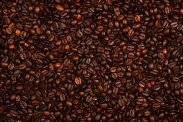 Coffee beans background. Top view. Coffee beans texture.