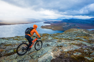 Fototapeta na wymiar Mountain biker on mountain scenery