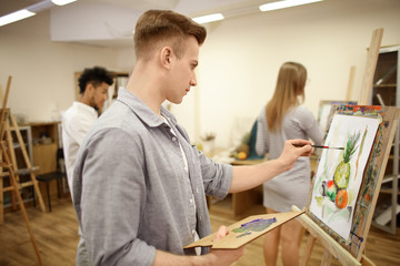 Fototapeta premium Art students painting in workshop