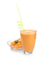 Glass with tasty melon smoothie on white background